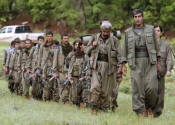 FILE - A group of armed Kurdish fighters from the Kurdistan Workers Party (PKK) enter northern Iraq in the Heror area, northeast of Dahuk, 260 miles (430 kilometers) northwest of Baghdad, Iraq, May 14, 2013. (AP Photo/Ceerwan Aziz, File)